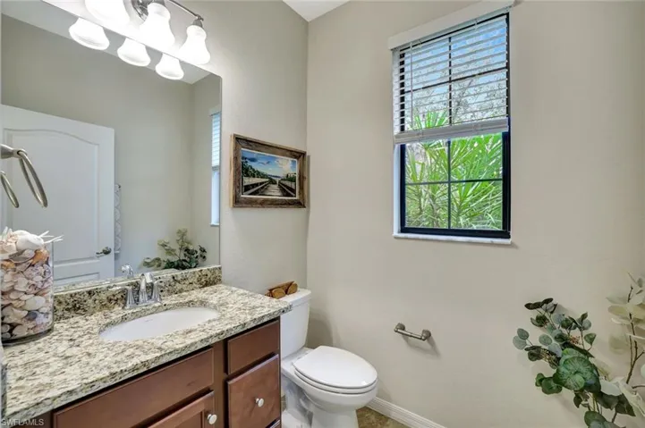 First floor powder room with granite counter.