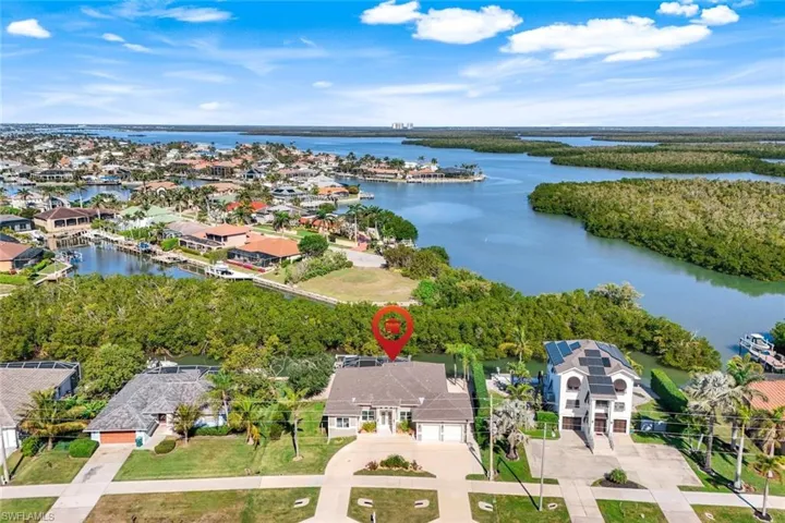 Aerial perspective of suburban area with a large body of water