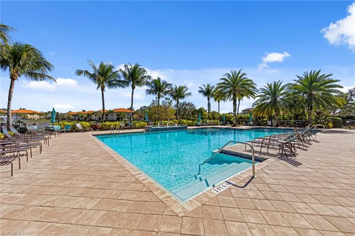 Community pool featuring a patio area