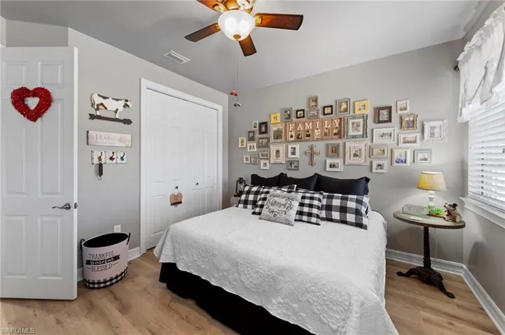 3rd Bedroom with ceiling fan, light wood-style flooring, and a closet