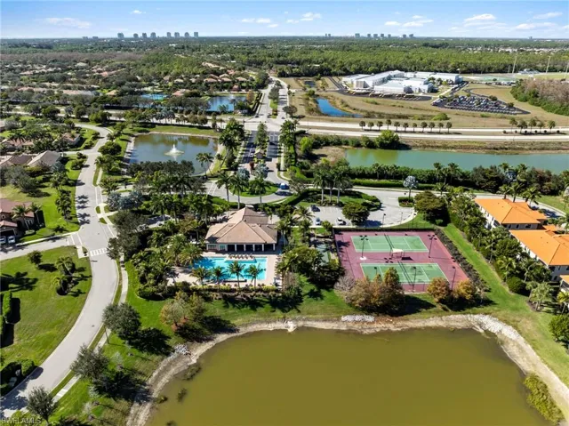 Aerial view of property's location featuring a large body of water and city skyline