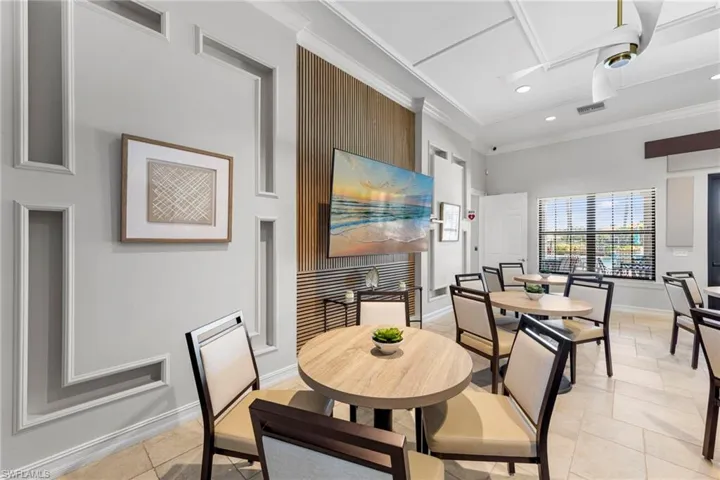 Dining room featuring crown molding, recessed lighting, and light tile patterned floors