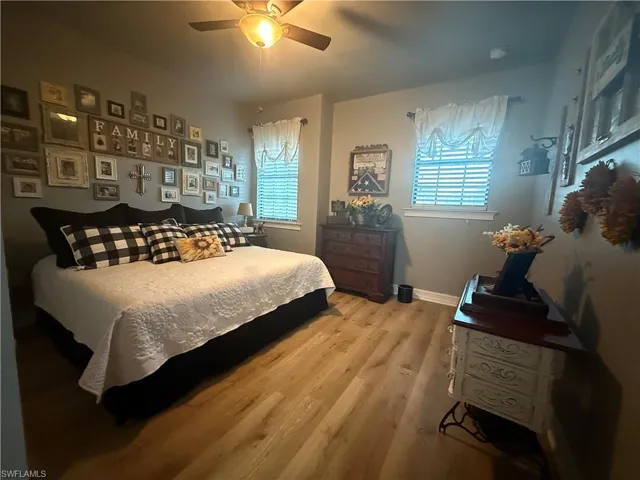 Bedroom featuring light wood-type flooring and a ceiling fan