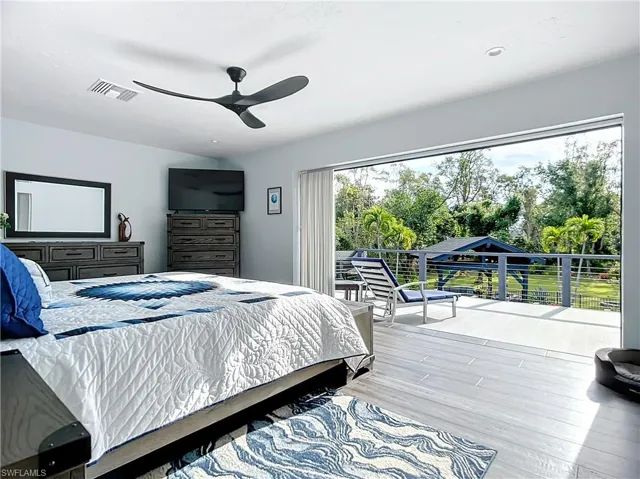 Primary Bedroom with sliders to connecting balcony