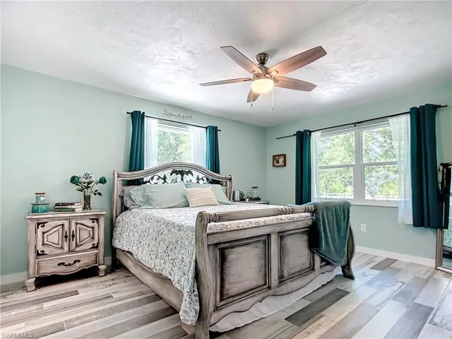 Large 3rd bedroom with a kingbed and ceiling fan