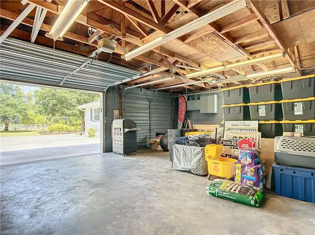 Garage featuring a garage door opener