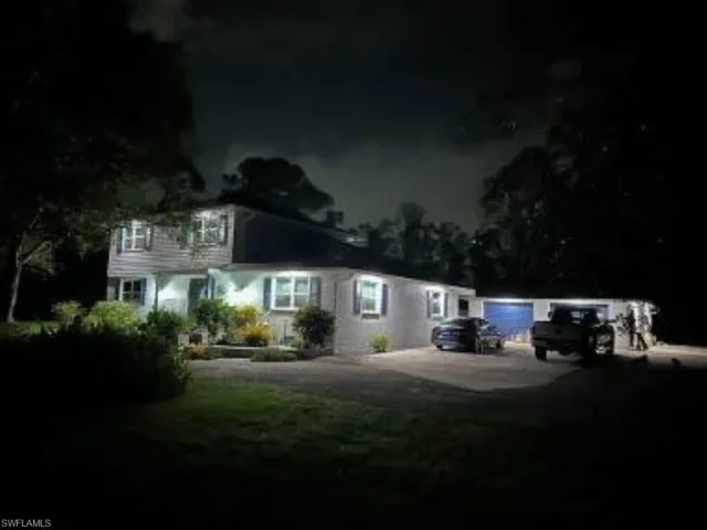 View of front of house featuring soffit lighting