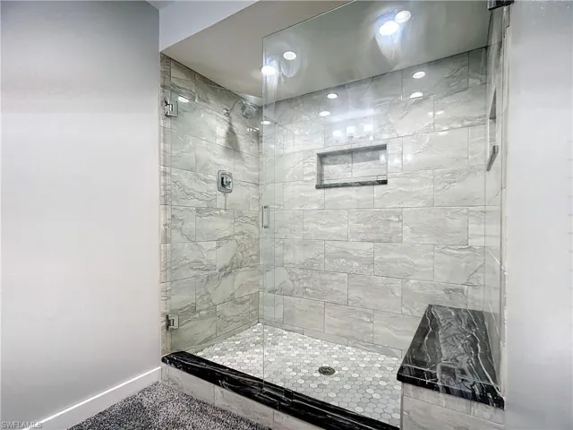 Downstairs bathroom featuring a designer stall shower