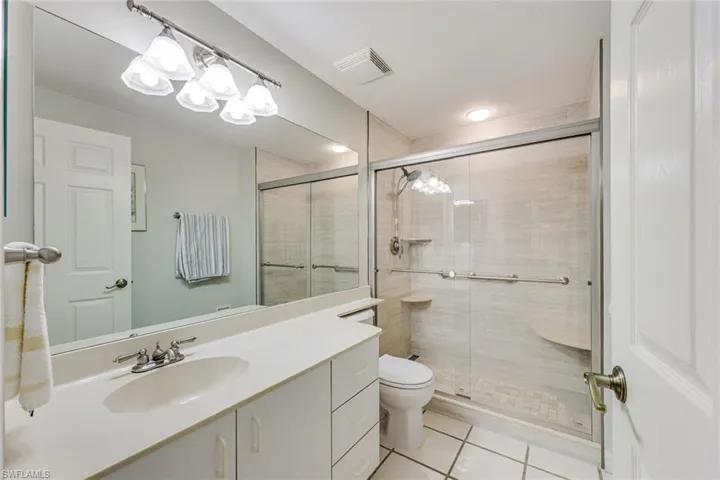 GUEST BATH WITH REMODELED SHOWER AND VANITY