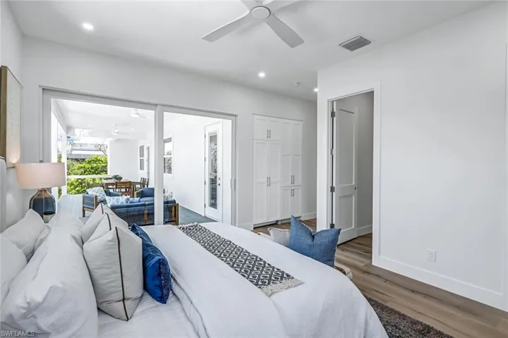Bedroom featuring wood finished floors, recessed lighting, baseboards, and ceiling fan