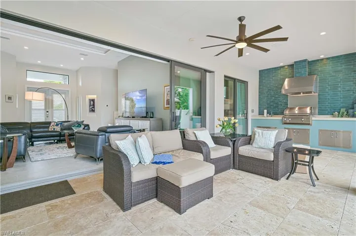 View of patio / terrace with an outdoor hangout area, exterior kitchen, and ceiling fan