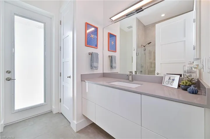 Full bath with vanity and a stall shower