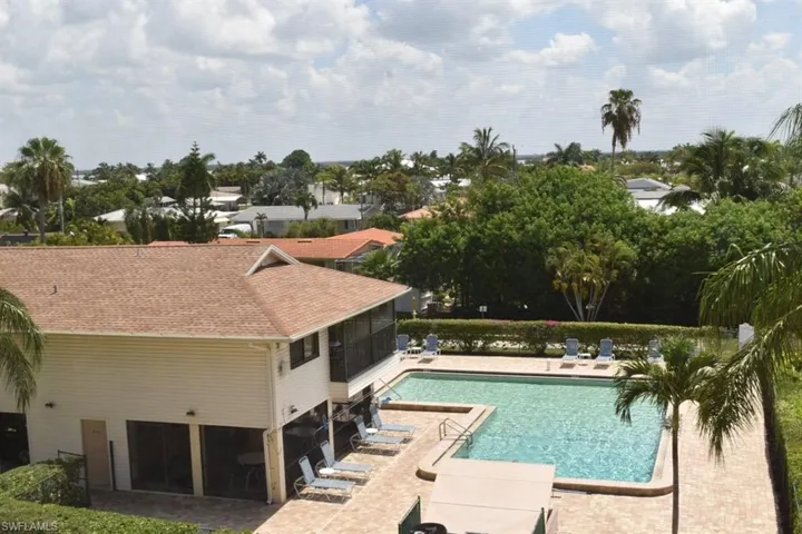 Community pool and community room under a condo.