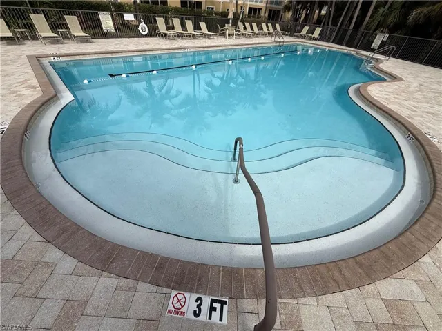 Community pool featuring a patio area