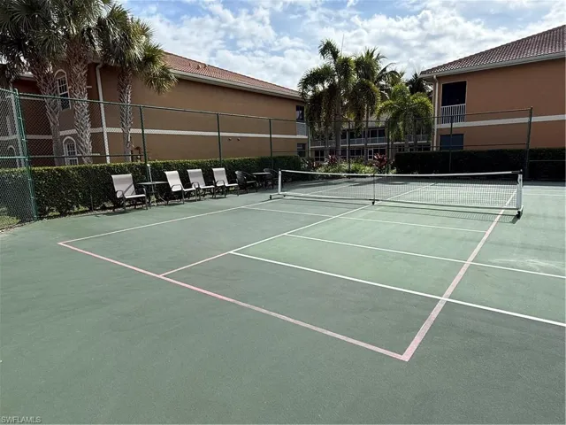 View of pickleball court setup in tennis court area