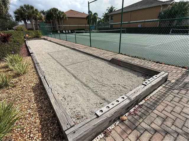 View of tennis court with a bocce ball area