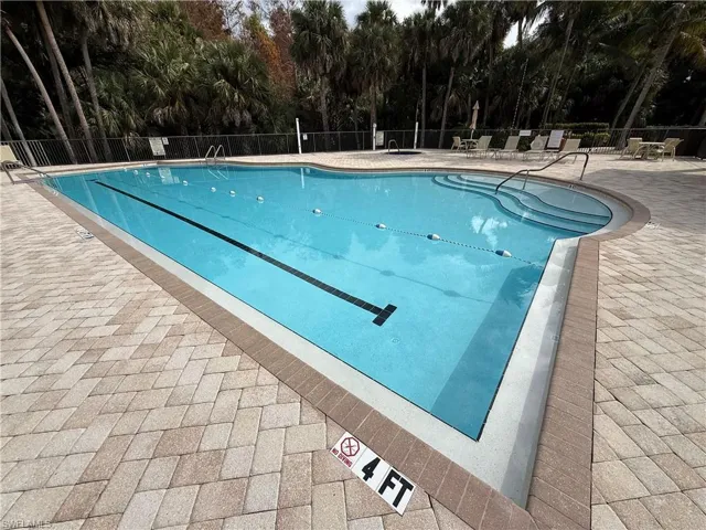 Community pool featuring a patio