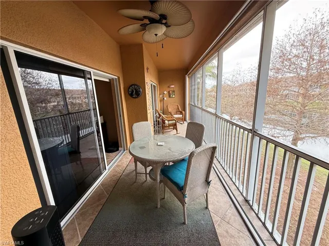 Lanai sitting area with a ceiling fan, plenty of natural light, and a balcony