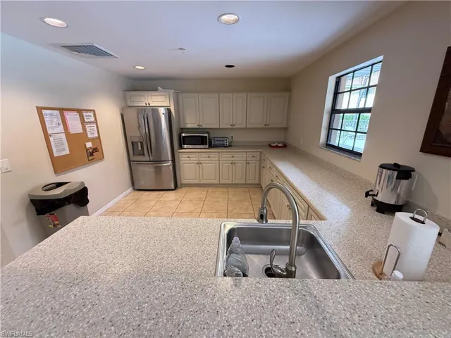 Clubhouse Kitchen with stainless steel appliances, recessed lighting, and light tile patterned floors