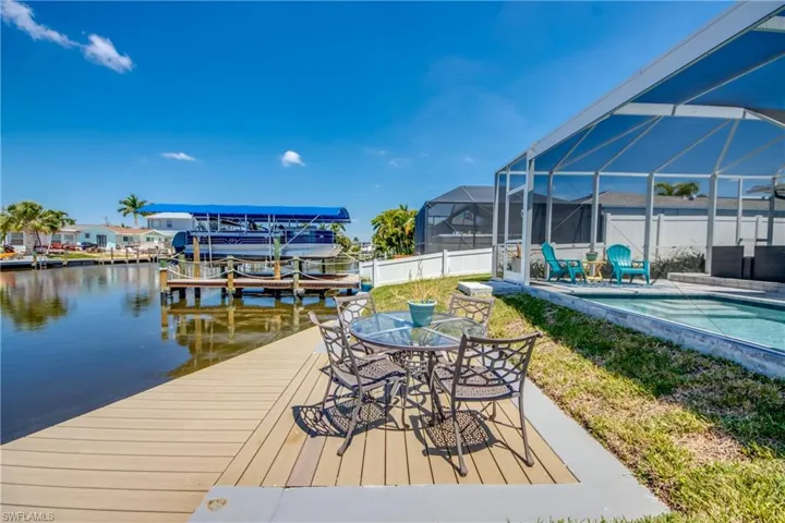 Dock area featuring a lanai and a water view