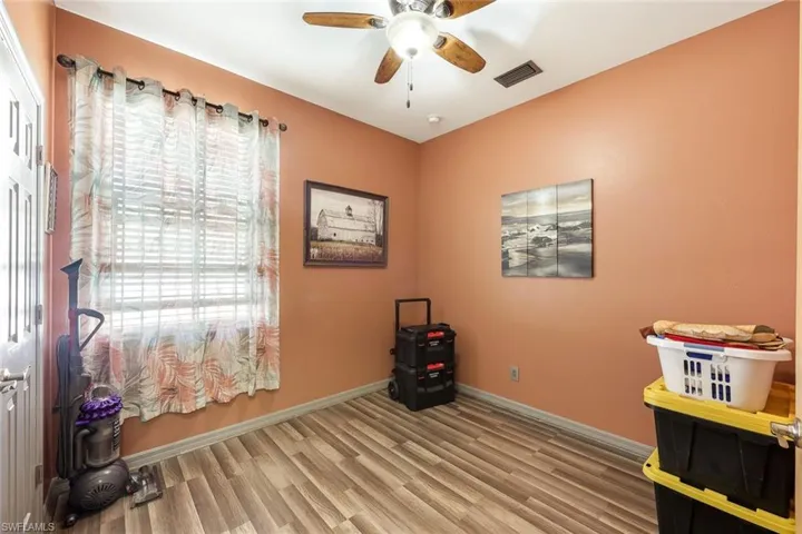 Misc room featuring light wood-style flooring and ceiling fan