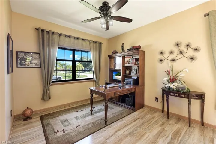 Office featuring light wood-type flooring and ceiling fan