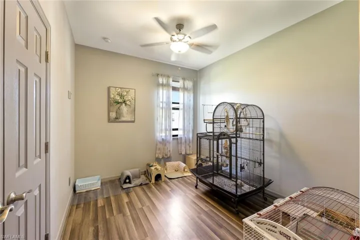 Bedroom with wood finished floors and ceiling fan