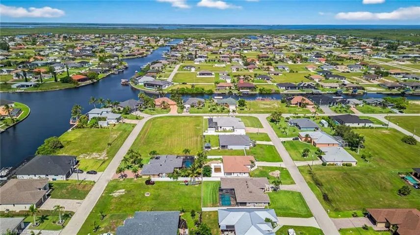 Aerial perspective of suburban area featuring nearby Gulf Access canals