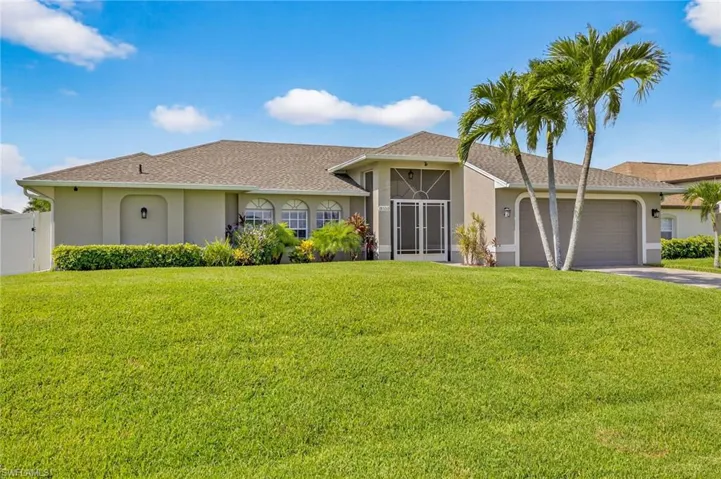 Ranch-style house with stucco siding, driveway, a garage, and roof with shingles