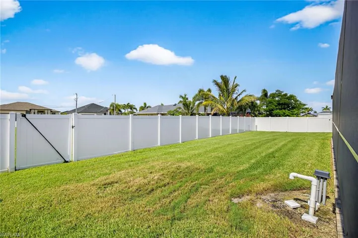 View of fenced backyard