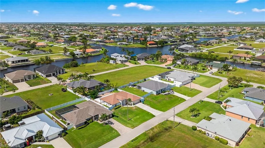 Aerial perspective of suburban area featuring nearby Gulf Access canals