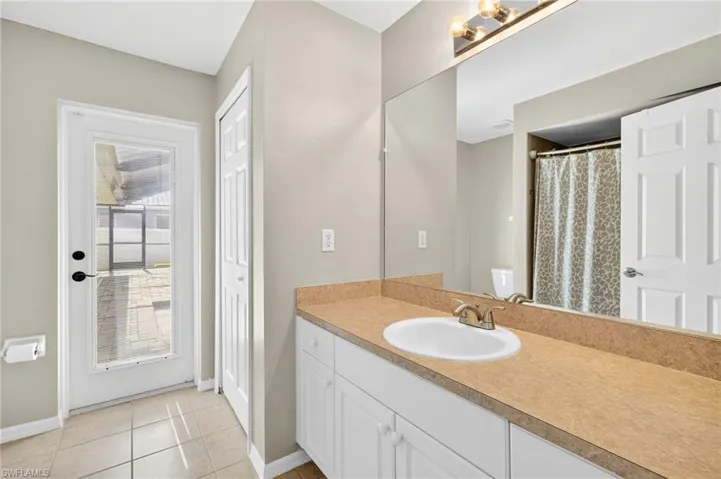 Bathroom featuring vanity and tile patterned flooring
