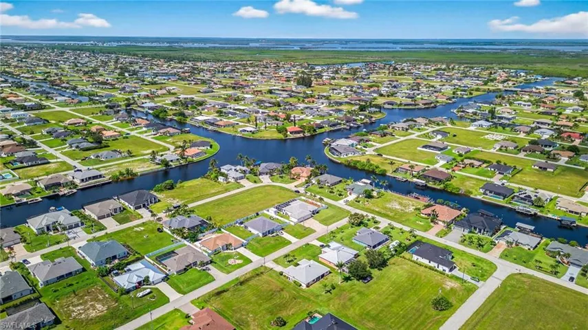 Aerial perspective of suburban area featuring nearby Gulf Access canals