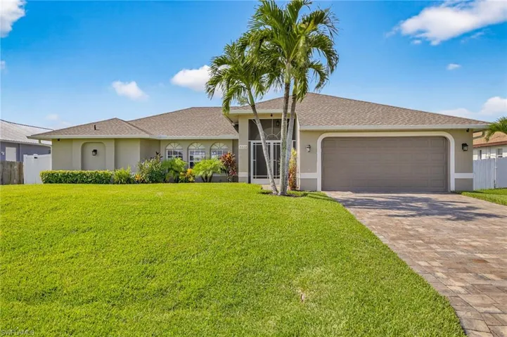 Single story home featuring stucco siding, decorative driveway, an attached garage, and NEW 2023 ROOF