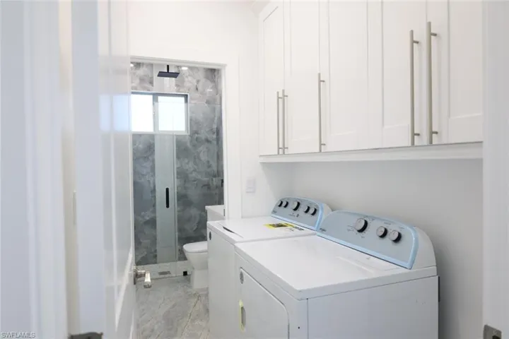 Laundry room featuring independent washer and dryer