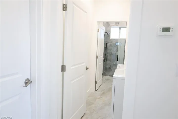 Hallway featuring washer / clothes dryer