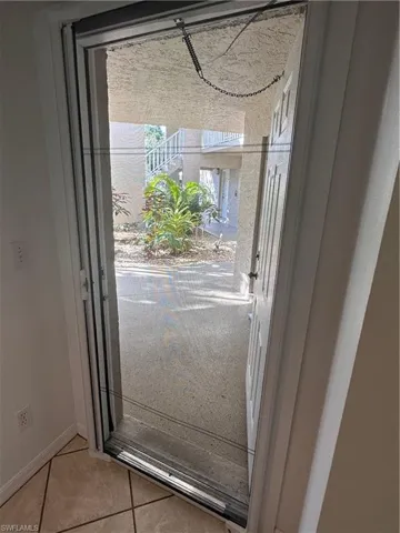 Screened front entry to enjoy those Florida breezes