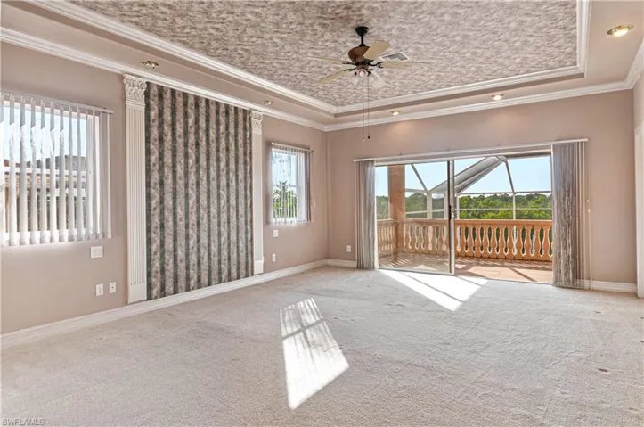 2nd story primary suite with sliders to balcony
