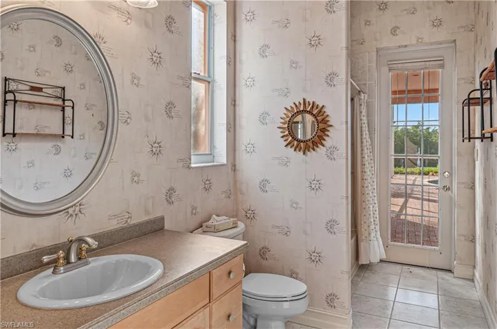 MAINFLOOR ensuite bath that walks out to the pool