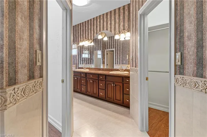 Primary bath with two closets and double sinks