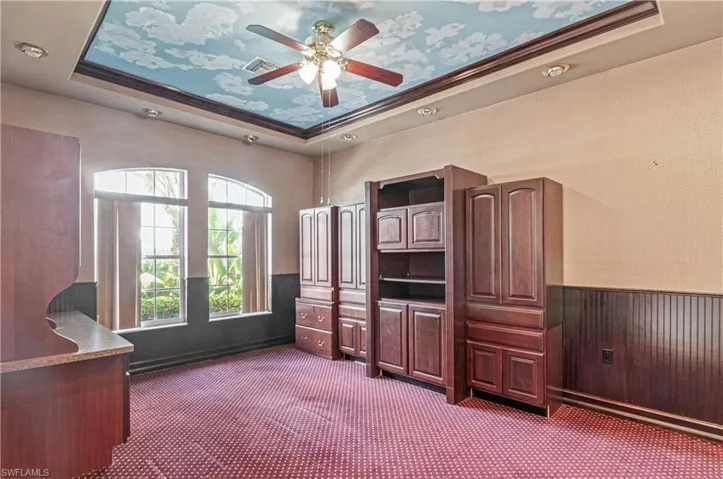 Main floor office with built in desk and file cabinets