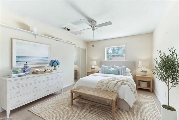 virtually staged 2nd Bedroom with a ceiling fan and baseboards