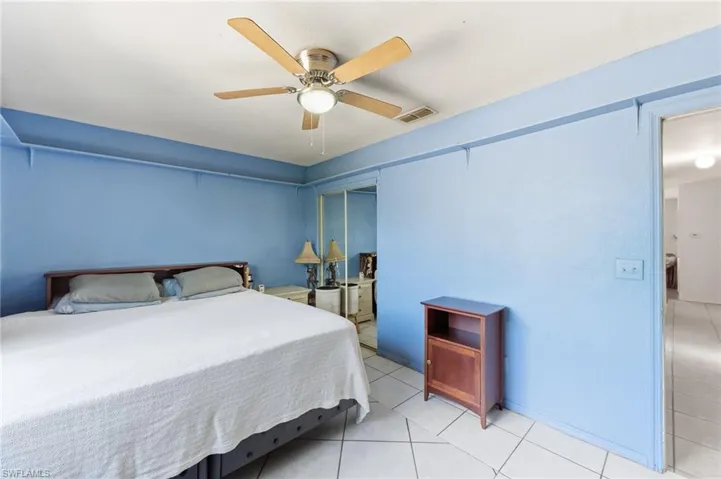 4th Bedroom featuring a ceiling fan, light tile patterned flooring, and a closet