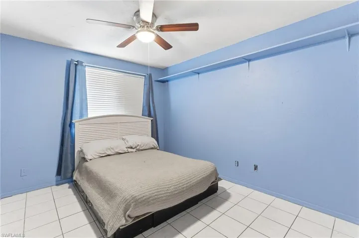 4th Bedroom with ceiling fan and light tile patterned floors