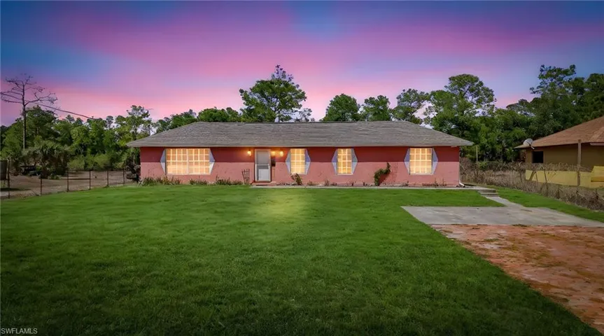 Ranch-style house with stucco siding