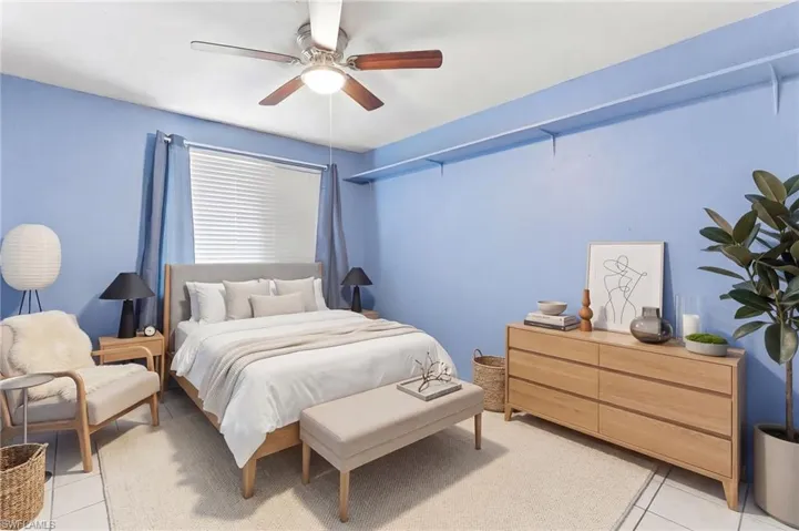 Virtually stage 4th Bedroom with light tile patterned floors and ceiling fan