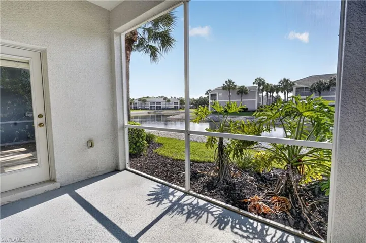 Screened patio with tropical landscaping, and clear views of the water
