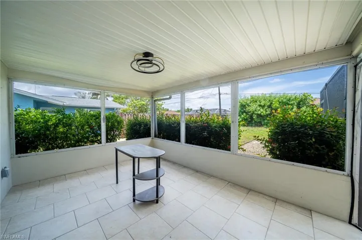 Unfurnished sunroom with healthy amount of natural light