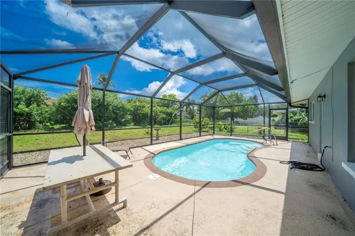 Outdoor pool featuring a patio and a lanai