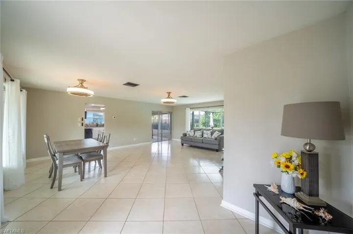 Dining room with light tile patterned flooring